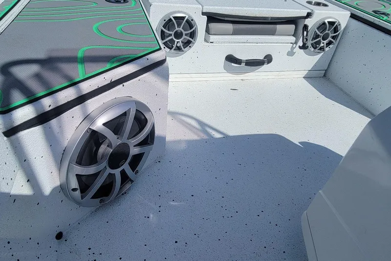 Slide: The Image of 2024 Xpress H22B Bay boat interior with speakers and storage compartments. - 19