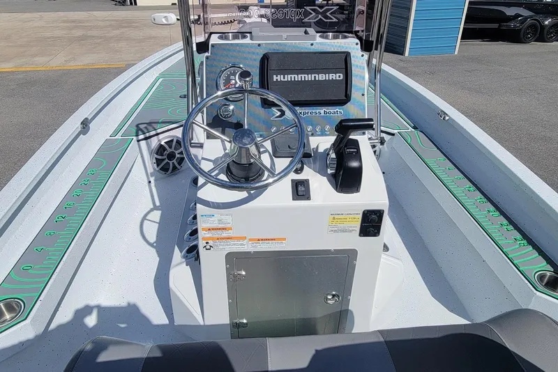 Slide: The Image of 2024 Xpress H22B Bay boat console with steering wheel and Humminbird electronics. - 6