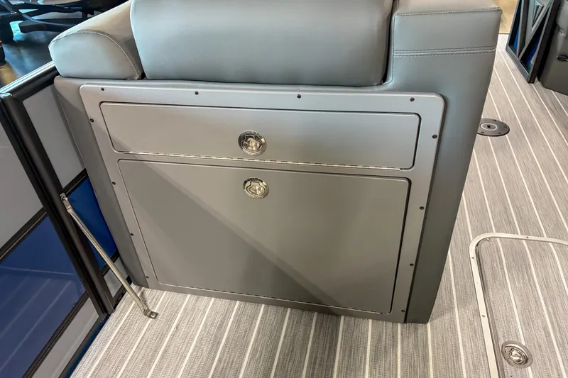 Slide: The Image of 2026 Trifecta 25 UL SS boat interior with sleek gray storage compartment. - 10