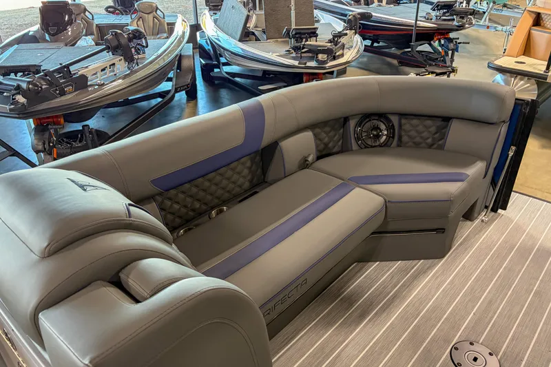 Slide: The Image of Luxurious interior of 2026 Trifecta 25 UL SS pontoon boat with plush seating. - 13