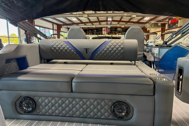 Slide: The Image of Luxurious seating on 2026 Trifecta 25 UL SS boat with quilted upholstery and cup holders. - 2