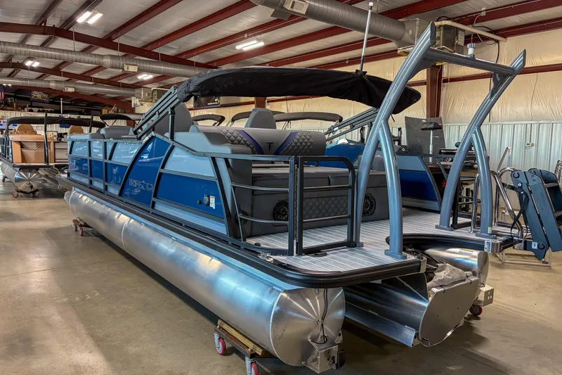 Slide: The Image of 2026 Trifecta 25 UL SS pontoon boat in a warehouse setting. - 3