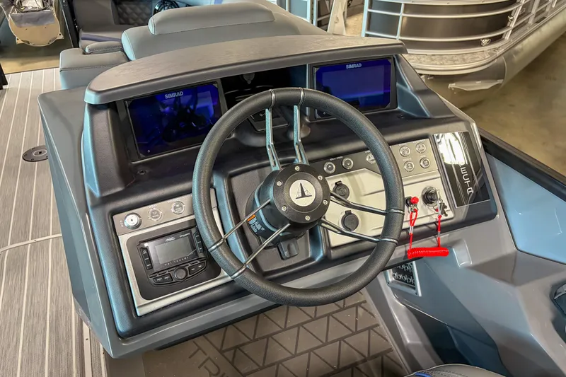 Slide: The Image of 2026 Trifecta 25 UL SS boat dashboard with steering wheel and control panel. - 6