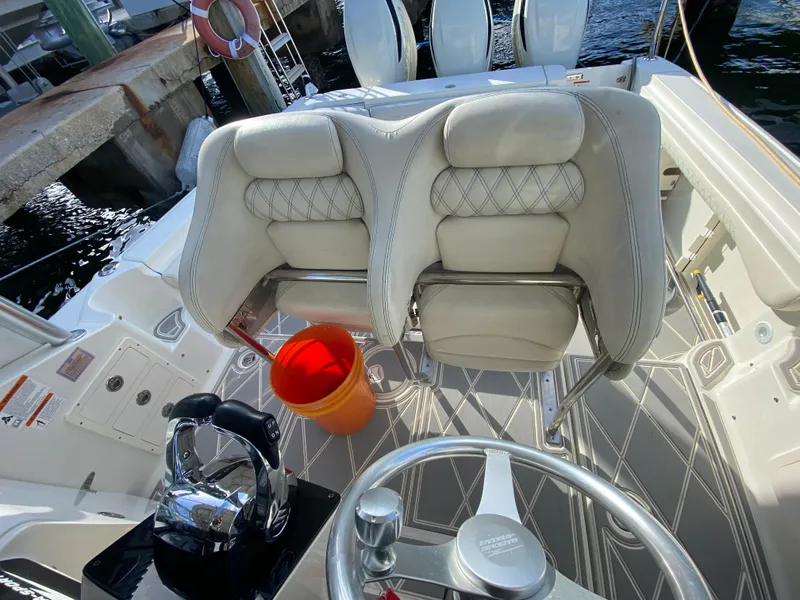 Slide: The Image of 2006 Hydra-Sports Vector 3300 VX boat interior with helm, seats, and orange bucket. - 21