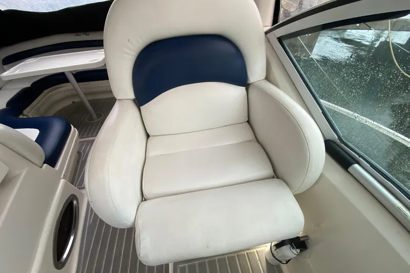 Slide: The Image of Captain's chair on 2004 Sea Ray 340 Sundancer boat, white and blue upholstery. - 20