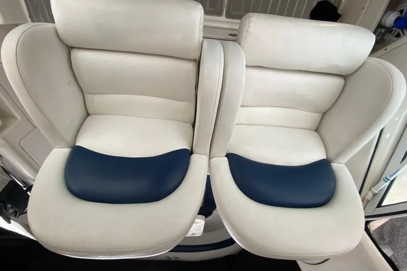 Slide: The Image of White and blue seats on a 2004 Sea Ray 340 Sundancer boat. - 21