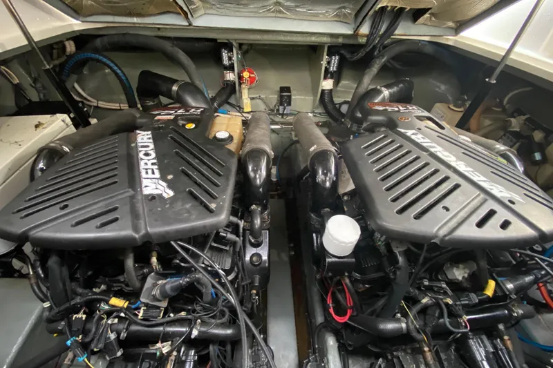 Slide: The Image of Engine compartment of a 2004 Sea Ray 340 Sundancer with twin Mercury engines. - 29