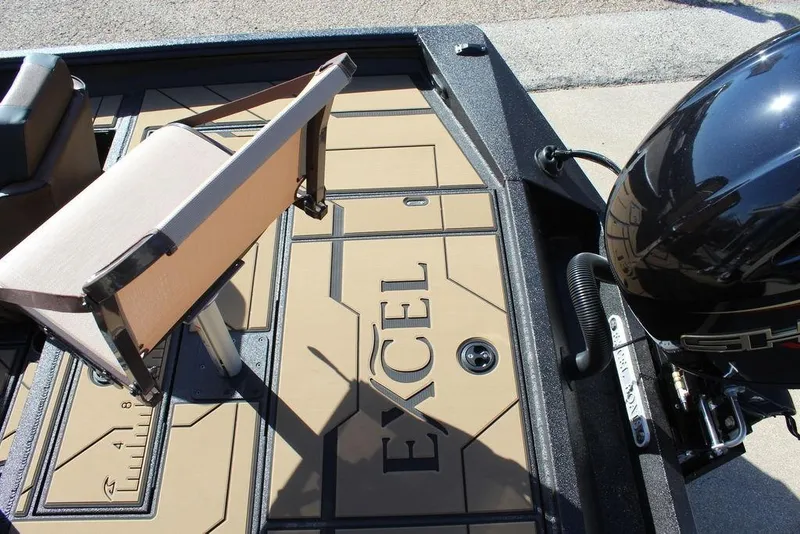 Slide: The Image of 2026 Excel EX 183 boat deck with seat and motor, showcasing brand logo. - 11