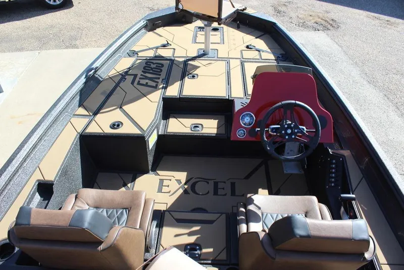 Slide: The Image of 2026 Excel EX 183 boat interior with steering wheel and seating. - 9