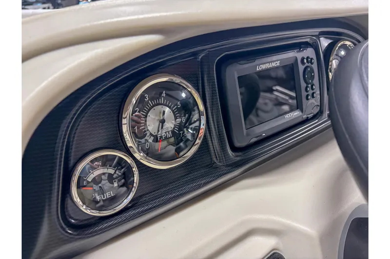 Slide: The Image of Dashboard of 2026 Trifecta 22 TRFC LE with gauges and Lowrance display. - 10