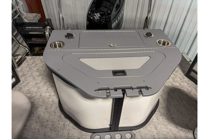 Slide: The Image of 2026 Trifecta 22 TRFC LE boat interior with modern console and cup holders. - 12