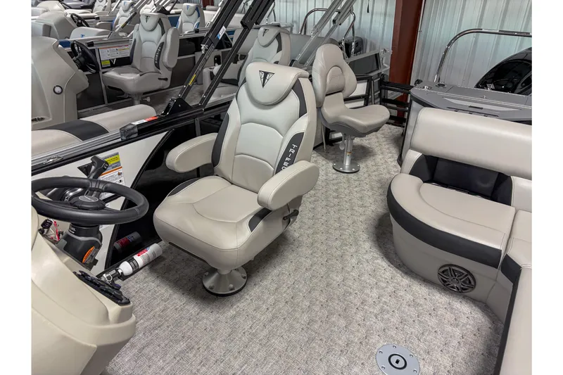 Slide: The Image of 2026 Trifecta 22 TRFC LE boat interior with plush seating and modern steering console. - 8
