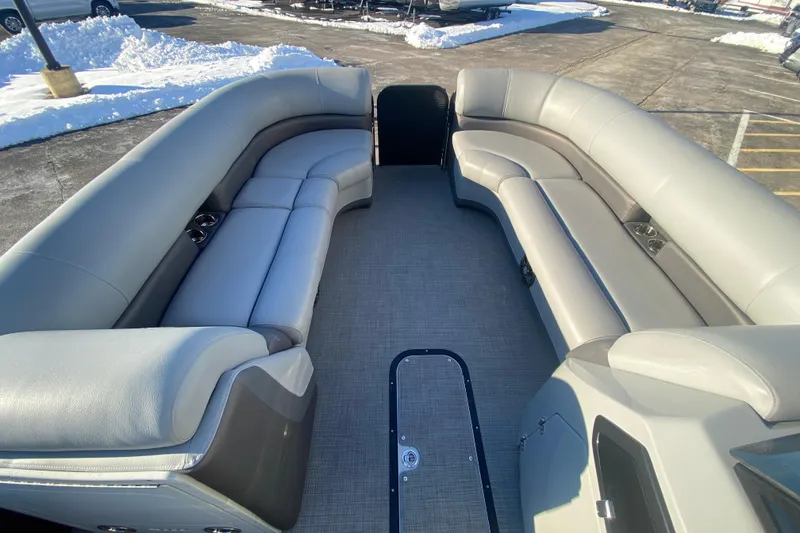 Slide: The Image of 2022 Manitou 25 OASIS RF SHP pontoon boat interior with spacious seating. - 10