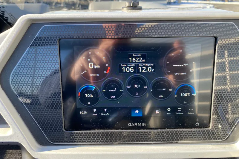 Slide: The Image of Garmin display on 2022 Manitou 25 OASIS RF SHP showing engine metrics and navigation data. - 18