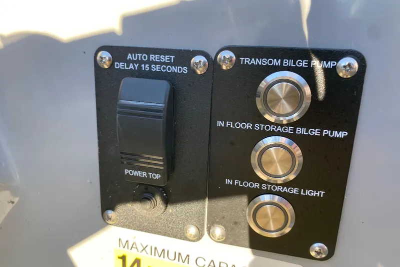 Slide: The Image of Control panel of 2022 Manitou 25 OASIS RF SHP with bilge pump switches. - 20