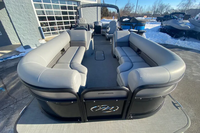 Slide: The Image of 2022 Manitou 25 OASIS RF SHP pontoon boat with spacious seating and modern design. - 9