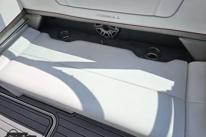 Slide: The Image of 2020 Formula 330 Crossover Bowrider interior with white seating and cup holders. - 100