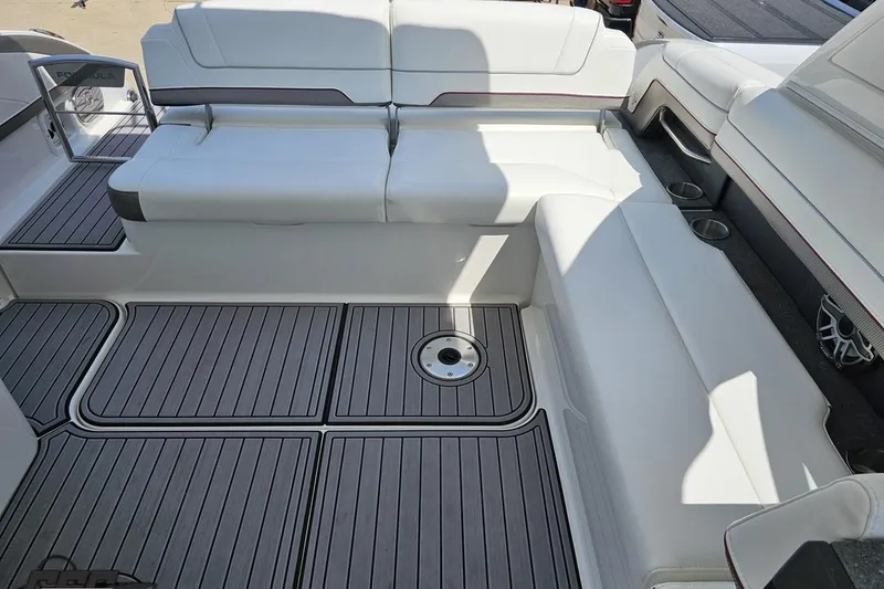 Slide: The Image of 2020 Formula 330 Crossover Bowrider interior with white seating and gray flooring. - 103