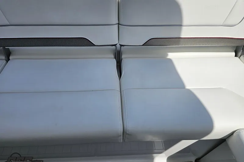 Slide: The Image of 2020 Formula 330 Crossover Bowrider, white leather seating detail, luxury boat interior. - 106