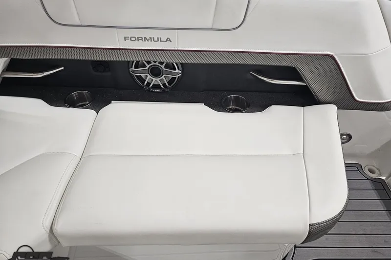 Slide: The Image of 2020 Formula 330 Crossover Bowrider interior with white seating and speaker system. - 108