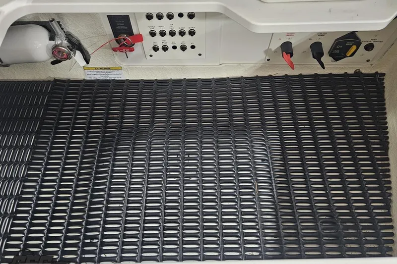 Slide: The Image of Control panel and safety equipment on a 2020 Formula 330 Crossover Bowrider boat. - 109