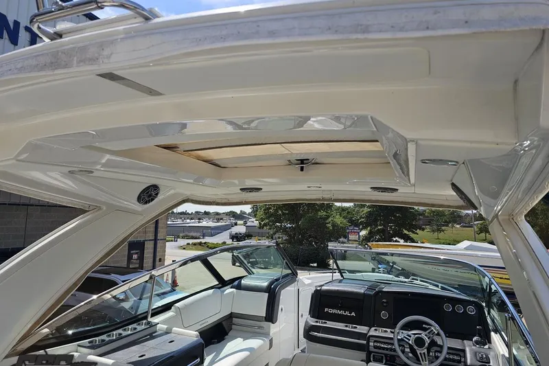 Slide: The Image of 2020 Formula 330 Crossover Bowrider interior with sleek dashboard and spacious seating. - 47