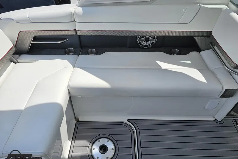 Slide: The Image of 2020 Formula 330 Crossover Bowrider interior with white seating and cup holders. - 50