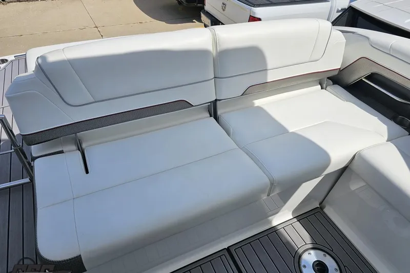 Slide: The Image of 2020 Formula 330 Crossover Bowrider interior seating with white upholstery and sleek design. - 51