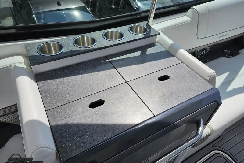 Slide: The Image of 2020 Formula 330 Crossover Bowrider interior with cup holders and sleek seating. - 55