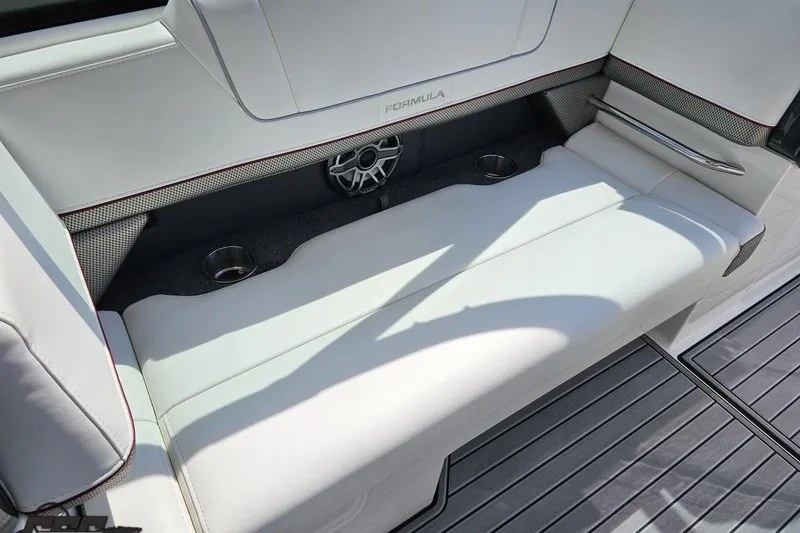 Slide: The Image of 2020 Formula 330 Crossover Bowrider interior with white seating and cup holders. - 57
