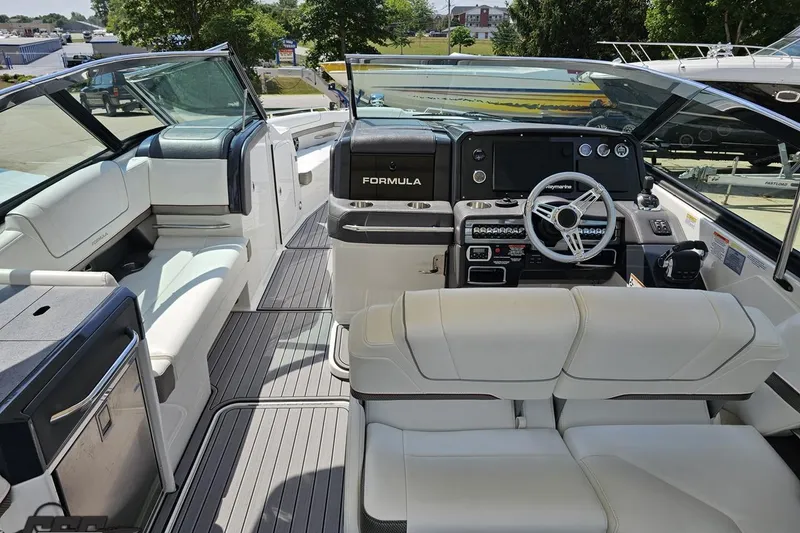 Slide: The Image of 2020 Formula 330 Crossover Bowrider interior with luxurious seating and modern dashboard. - 58