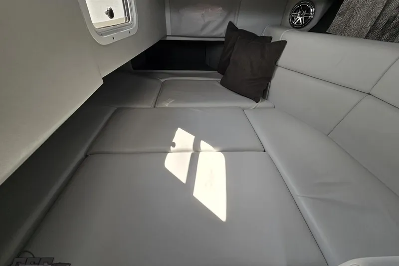 Slide: The Image of 2020 Formula 330 Crossover Bowrider interior with gray seating and cushions. - 76