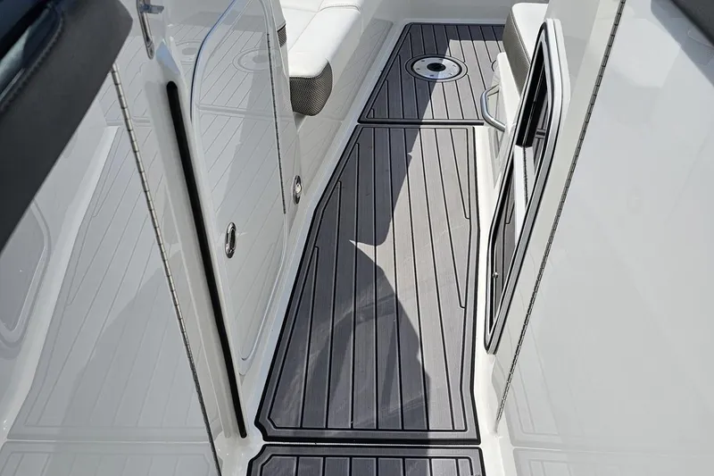 Slide: The Image of 2020 Formula 330 Crossover Bowrider deck with sleek, modern design and comfortable seating. - 86