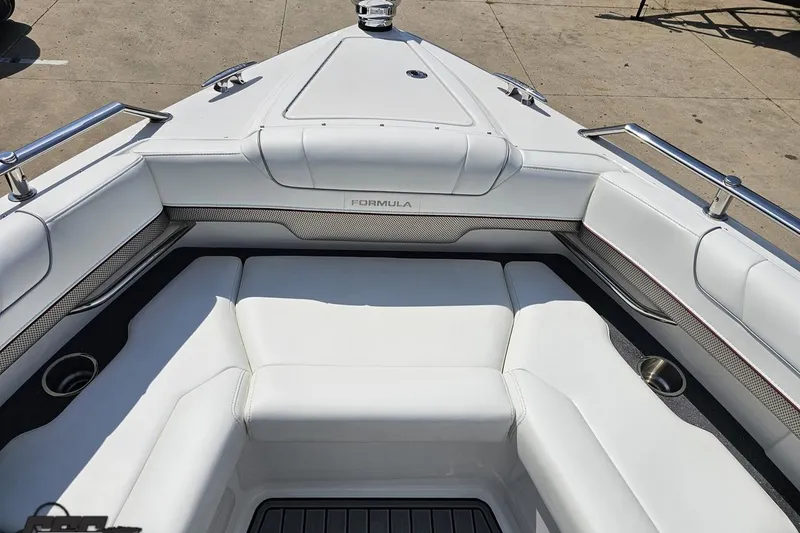 Slide: The Image of 2020 Formula 330 Crossover Bowrider with luxurious white seating and stainless steel accents. - 93