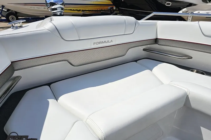 Slide: The Image of 2020 Formula 330 Crossover Bowrider interior with white seating and sleek design. - 95