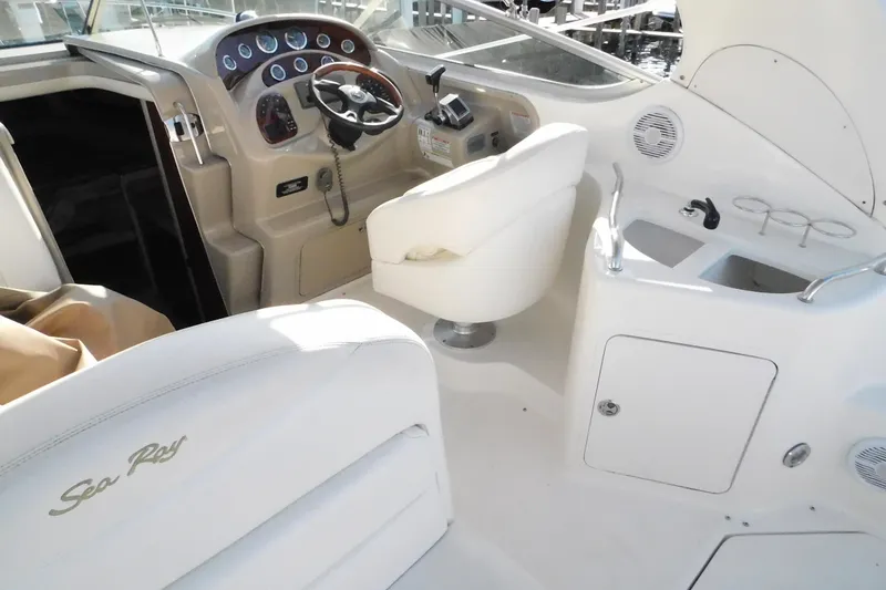 Slide: The Image of 2001 Sea Ray Sundancer 280 cockpit with steering wheel, seating, and control panel. - 12