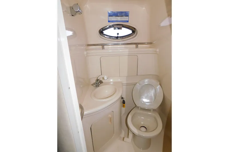 Slide: The Image of Compact bathroom in 2001 Sea Ray Sundancer 280 yacht with sink and toilet. - 23