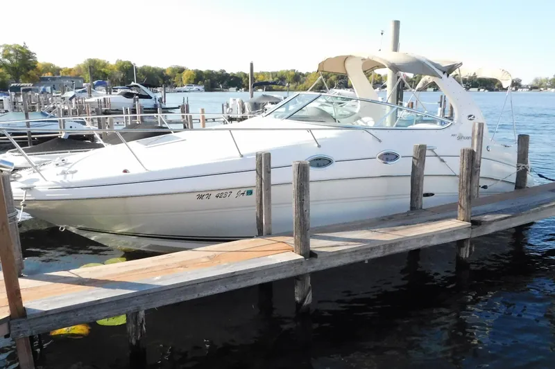 Slide: The Image of 2001 Sea Ray Sundancer 280 docked at a marina on a sunny day. - 3