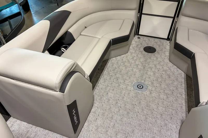 Slide: The Image of Luxurious interior of 2026 Trifecta 24RF LE pontoon boat with plush seating. - 5