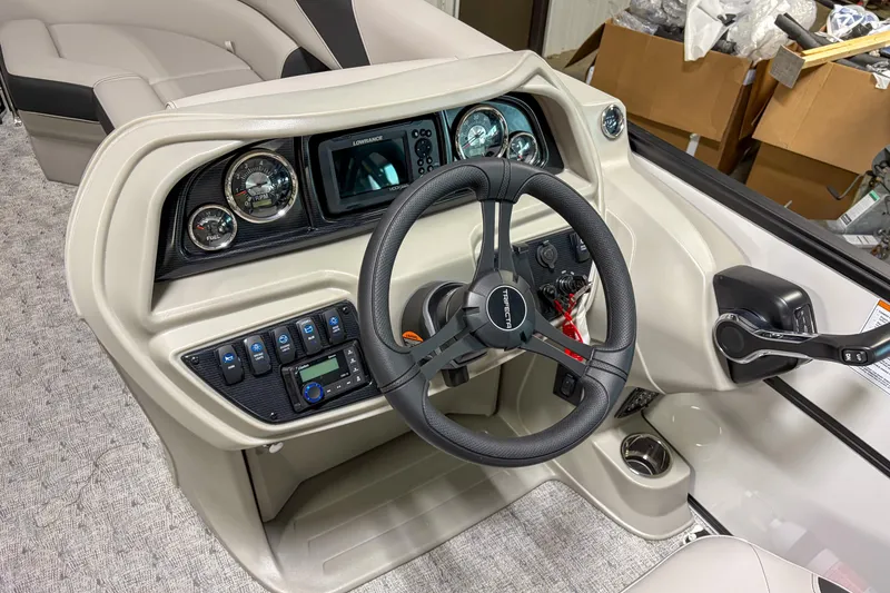 Slide: The Image of Steering console of 2026 Trifecta 24RF LE boat with modern controls and gauges. - 9
