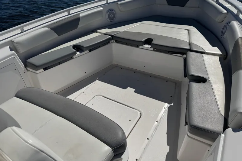 Slide: The Image of 2017 Everglades 243 Center Console boat interior with cushioned seating. - 12