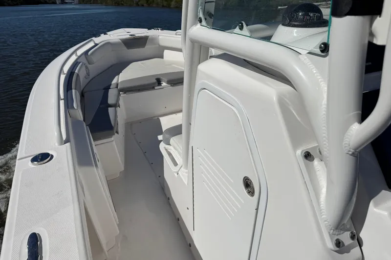 Slide: The Image of 2017 Everglades 243 Center Console boat interior on calm water. - 19