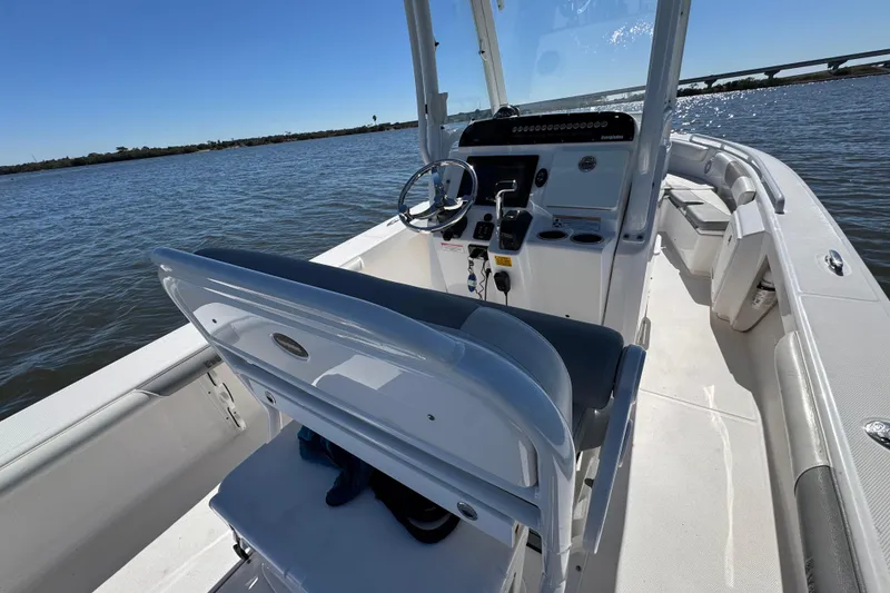 Slide: The Image of 2017 Everglades 243 Center Console boat interior on calm water, sunny day. - 9