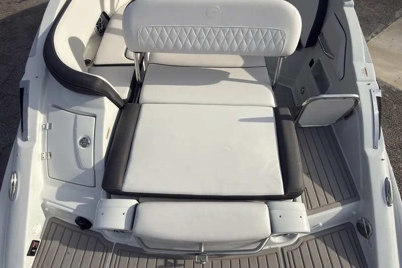 Slide: The Image of 2026 Crownline Eclipse E255 boat interior with white cushioned seating and sleek design. - 10