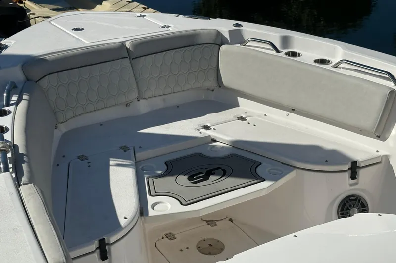 Slide: The Image of 2023 Sea Fox 268 Commander boat interior with cushioned seating and storage compartments. - 12