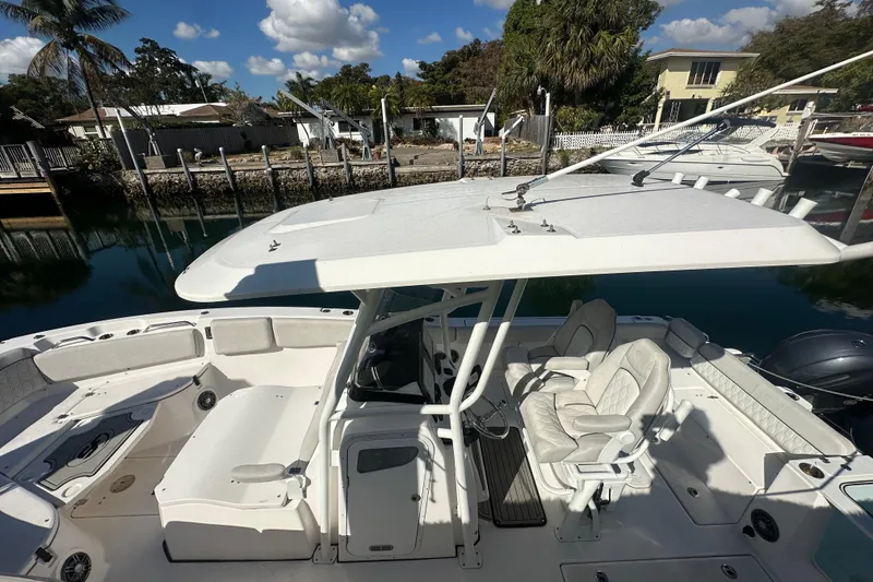 Slide: The Image of 2023 Sea Fox 268 Commander boat docked, featuring spacious seating and modern design. - 19