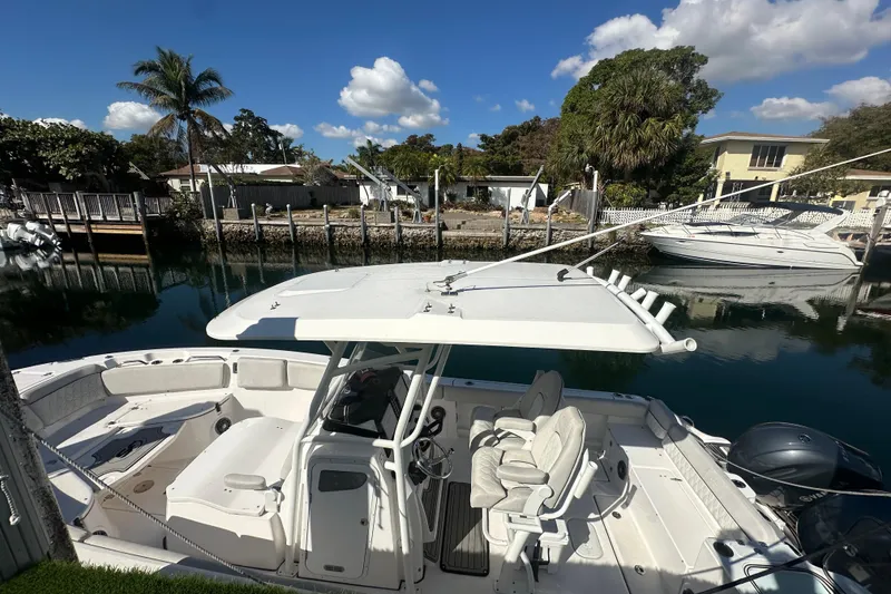 Slide: The Image of 2023 Sea Fox 268 Commander boat docked in a scenic waterfront setting. - 20