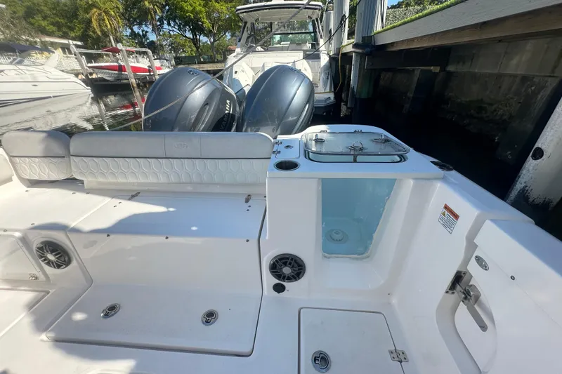 Slide: The Image of 2023 Sea Fox 268 Commander boat interior with dual engines and seating area. - 24