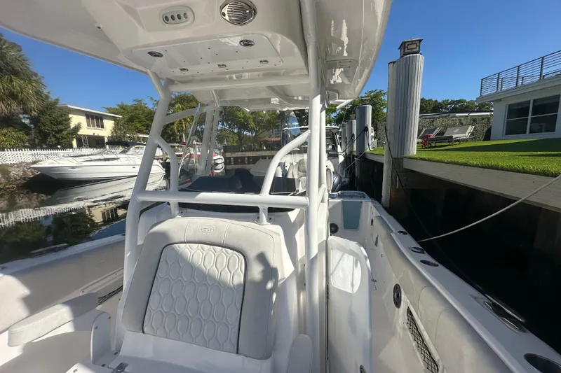 Slide: The Image of 2023 Sea Fox 268 Commander boat docked, showcasing sleek design and spacious interior. - 26