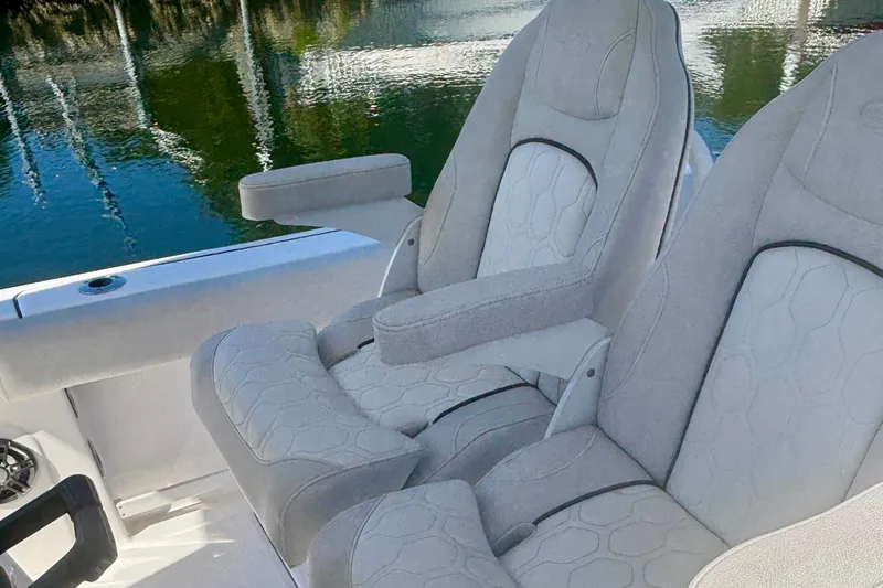 Slide: The Image of 2023 Sea Fox 268 Commander boat dashboard with steering wheel and navigation controls. - 5